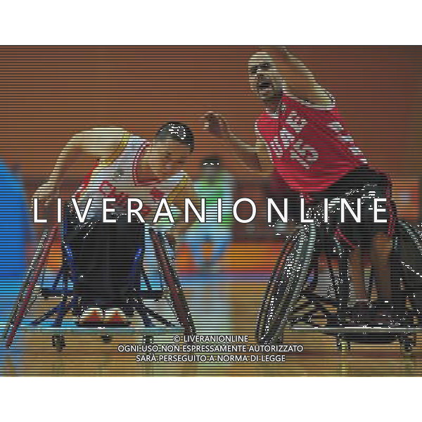 (101214) -- GUANGZHOU, Dec. 14, 2010 () -- Tariq Baniyas (R) of United Arab Emirates makes defense during the preliminary group A match of the men\'s wheelchair basketball competition against China at the Guangzhou 2010 Asian Para Games in Guangzhou, south China\'s Guangdong Province, Dec. 14, 2010. China won 70-40. (/Hao Tongqian) AG. ALDO LIVERANI SAS ITALY ONLY