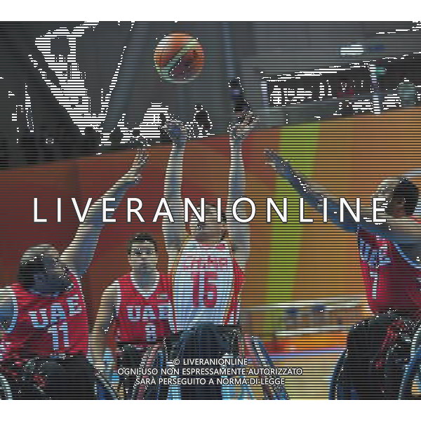 (101214) -- GUANGZHOU, Dec. 14, 2010 () -- Yan Lei (C) of China shoots during the preliminary group A match of the men\'s wheelchair basketball competition against United Arab Emirates at the Guangzhou 2010 Asian Para Games in Guangzhou, south China\'s Guangdong Province, Dec. 14, 2010. China won 70-40. (/Hao Tongqian) AG. ALDO LIVERANI SAS ITALY ONLY