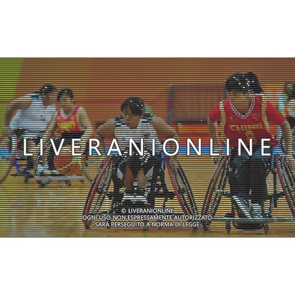 (101214) -- GUANGZHOU, Dec. 14, 2010 () -- China\'s Wang Xiaoyan (1st R) vies with Pornthip Kachunram of Thailand during the group A match of women\'s wheelchair basketball competition at the Guangzhou 2010 Asian Para Games in Guangzhou, south China\'s Guangdong Province, Dec. 14, 2010. China won 80-18. (/Hao Tongqian) AG. ALDO LIVERANI SAS ITALY ONLY