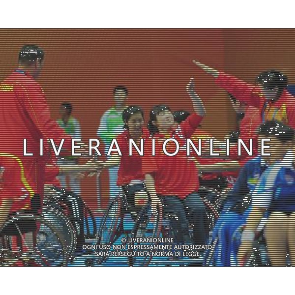(101214) -- GUANGZHOU, Dec. 14, 2010 () -- China\'s players clap hands with each other before the group A match of women\'s wheelchair basketball competition against Thailand at the Guangzhou 2010 Asian Para Games in Guangzhou, south China\'s Guangdong Province, Dec. 14, 2010. China won 80-18. (/Hao Tongqian) AG. ALDO LIVERANI SAS ITALY ONLY