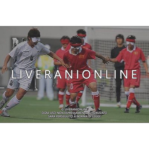 (101214) -- GUANGZHOU, Dec. 14, 2010 () -- Zheng Wenfa (front R) of China competes during the preliminary match of the men\'s football 5-a-side competition against South Korea at the Guangzhou 2010 Asian Para Games in Guangzhou, south China\'s Guangdong Province, Dec. 14, 2010. China won 4-0. (/Nie Jianjiang) AG. ALDO LIVERANI SAS ITALY ONLY