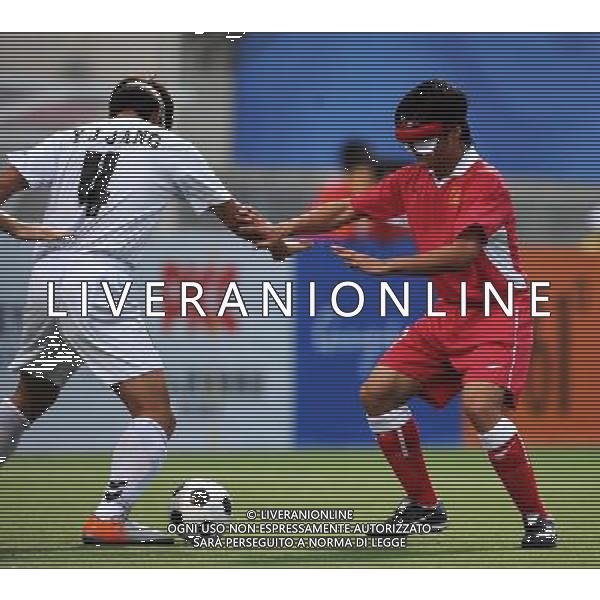 (101214) -- GUANGZHOU, Dec. 14, 2010 () -- Zheng Wenfa (R) of China tries to block Jang Yeongjun of South Korea during the preliminary match of the men\'s football 5-a-side competition at the Guangzhou 2010 Asian Para Games in Guangzhou, south China\'s Guangdong Province, Dec. 14, 2010. China won 4-0. (/Nie Jianjiang) AG. ALDO LIVERANI SAS ITALY ONLY