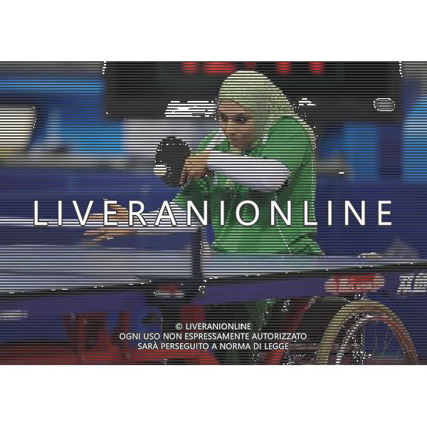 (101214) -- GUANGZHOU, Dec. 14, 2010 () -- Suhair Igzar of Iraq competes during the group B match 3 of the women\'s singles TT 5 of the table tennis competition against Wei Mei Hui of Chinese Taipei at the Guangzhou 2010 Asian Para Games in Guangzhou, south China\'s Guangdong Province, Dec. 14, 2010. Suhair Igzar lost 0-3. (/Xu Yu) AG. ALDO LIVERANI SAS ITALY ONLY