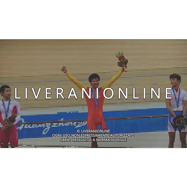 (101214) -- GUANGZHOU, Dec. 14, 2010 () -- Goldmedalist China\'s Liang Guihua (C), silver medalist Japan\'s Masaki Fujita (L) and bronze medalist South Korea\'s Jin Yong Sik react during the awarding ceremony of the mixed C1-3m\'C1-5w 3km ind pursuit final of cycling track competition at the Guangzhou 2010 Asian Para Games in Guangzhou, south China\'s Guangdong Province, Dec. 14, 2010. (/Lu Hanxin) AG. ALDO LIVERANI SAS ITALY ONLY