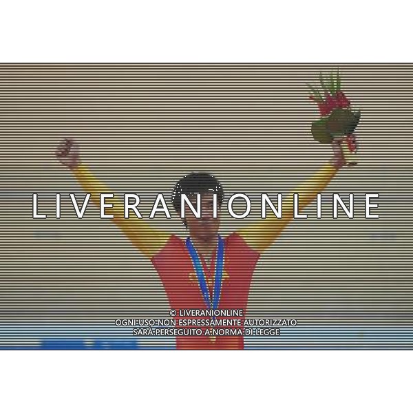 (101214) -- GUANGZHOU, Dec. 14, 2010 () -- Goldmedalist China\'s Liang Guihua reacts during the awarding ceremony of the mixed C1-3m\'C1-5w 3km ind pursuit final of cycling track competition at the Guangzhou 2010 Asian Para Games in Guangzhou, south China\'s Guangdong Province, Dec. 14, 2010. (/Lu Hanxin) AG. ALDO LIVERANI SAS ITALY ONLY
