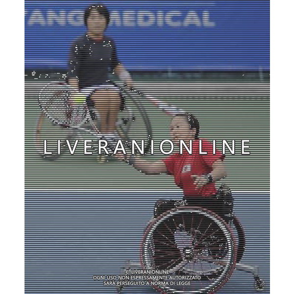 (101214) -- GUANGZHOU, Dec. 14, 2010 () -- Japan\'s Yuko Okabe (R) and Kanako Komori compete during round robin of the women\'s doubles of wheelchair tennis competition against Huang Huimin and Huang Jinlian of China at the Guangzhou 2010 Asian Para Games in Guangzhou, south China\'s Guangdong Province, Dec. 14, 2010. Yuko Okabe and Kanako Komori won 2-0. (/Yue Yuewei) AG. ALDO LIVERANI SAS ITALY ONLY