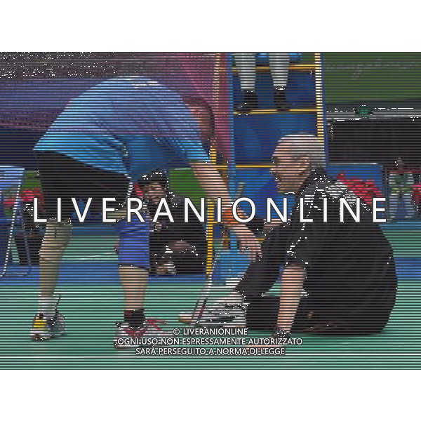 (101214) -- GUANGZHOU, Dec. 14, 2010 () -- China\'s Tian Shiwei (L) helps Malaysia\'s Md Radhi Juhari to stand up during the men\'s singles BMSTL1 semifinal of badminton competition at the Guangzhou 2010 Asian Para Games in Guangzhou, south China\'s Guangdong Province, Dec. 14, 2010. Tian Shiwei won 2-1. (/Wang Song) AG. ALDO LIVERANI SAS ITALY ONLY