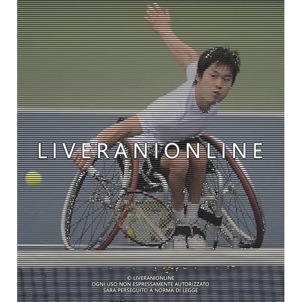 (101214) -- GUANGZHOU, Dec. 14, 2010 () -- Japan\'s Shingo Kunieda competes during the 2nd round of the men\'s singles open of wheelchair tennis competition against Wei Zujun of China at the Guangzhou 2010 Asian Para Games in Guangzhou, south China\'s Guangdong Province, Dec. 14, 2010. Shingo Kunieda won 2-0 to enter the next round. (/Yue Yuewei) AG. ALDO LIVERANI SAS ITALY ONLY
