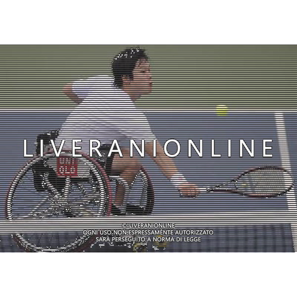 (101214) -- GUANGZHOU, Dec. 14, 2010 () -- Japan\'s Shingo Kunieda competes during the 2nd round of the men\'s singles open of wheelchair tennis competition against Wei Zujun of China at the Guangzhou 2010 Asian Para Games in Guangzhou, south China\'s Guangdong Province, Dec. 14, 2010. Shingo Kunieda won 2-0 to enter the next round. (/Yue Yuewei) AG. ALDO LIVERANI SAS ITALY ONLY