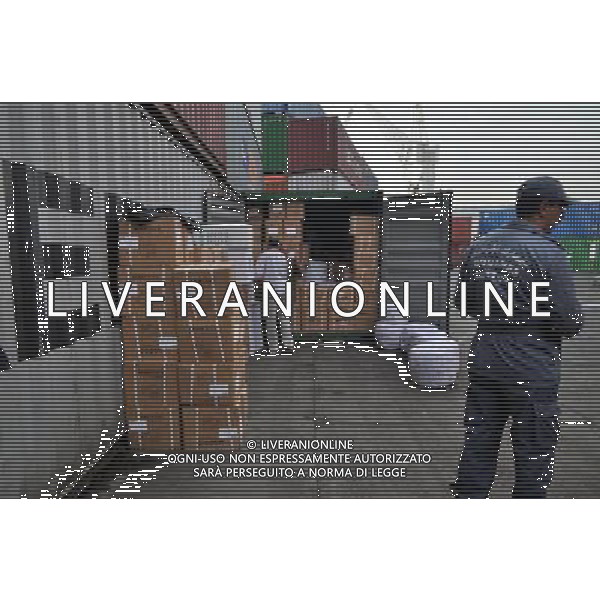 (101130) -- ALGIERS, Nov. 30, 2010 () -- A customs worker stands near the freight containers at the Port of Algiers in northern Algeria, Nov. 30, 2010. The Port of Algiers is one of the most important seaports in North Africa, and it is an important economic, financial, and commercial center for Algeria. (/Mohamed Kadri) (zw) AG. ALDO LIVERANI SAS ITALY ONLY