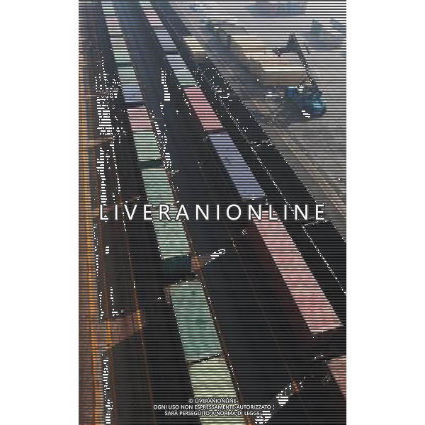 (101201) -- LIANYUNGANG, Dec. 1, 2010 () -- Two cargo trains are seen in Lianyungang Port in Liangyungang, east China\'s Jiangsu Province, Dec. 1, 2010. It is the 18th anniversary of the launching of the second Asia-Europe Land Bridge Wednesday. The Land Bridge, put into operation in 1992, is the most economical and fastest Asia-Europe land rail route at present. The 10,870-km route starts from east China\'s coastal city of Lianyungang, and finishes at Netherland\'s Rotterdam. (/Wang Jianmin) (wxy) AG. ALDO LIVERANI SAS ITALY ONLY