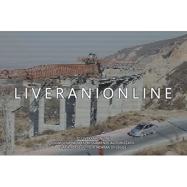 (101201) -- YUNCHENG, Dec. 1, 2010 () -- A vehicle passes by part of the Yuncheng-Lingbao Highway Road in construction, in Yuncheng City, north China\'s Shanxi Province, Nov. 30, 2010. The Yuncheng-Lingbao Highway Road connecting Shanxi Province and central China\'s Henan Province, with a total length of 30.95 km including 9.67 km of the tunnel in the Zhongtiao Mountain, will be put into service in 2013. (/Chen Wei) AG. ALDO LIVERANI SAS ITALY ONLY