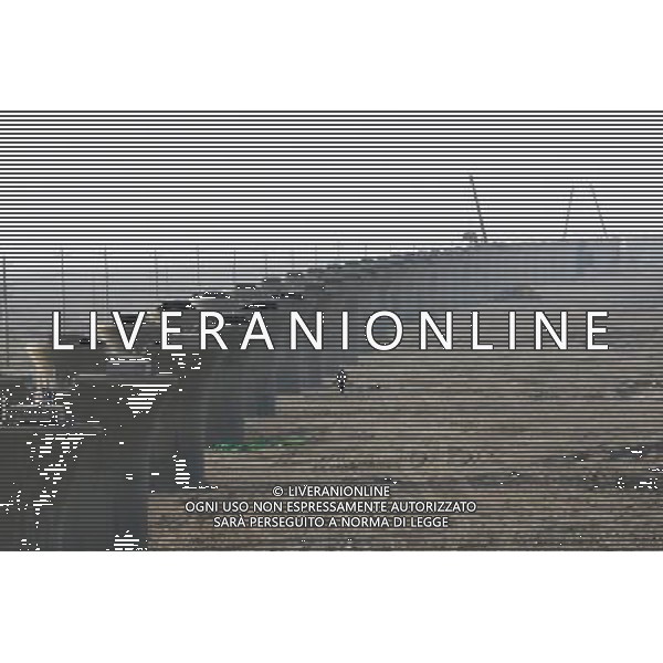 (101201) -- TURPAN, Dec. 1, 2010 () -- Photo taken on Nov. 30, 2010 shows bridge pillars of the Lanzhou-Xinjiang Railway crossing the wind field, which is dubbed as \'ghost\' for that windstorms of above 100 km per hour often running through it which once overthrown a train in 2007, in Turpan, northwest China\'s Xinjiang Uygur Autonomous Region. Workers began laying 900-ton box girders on Tuesday onto those pillars with a total length of 7.795 km in the \'ghost\' wind field. The box girder laying operation will be finish by next April. (/Jiang Xiaoming) (zn) AG. ALDO LIVERANI SAS ITALY ONLY