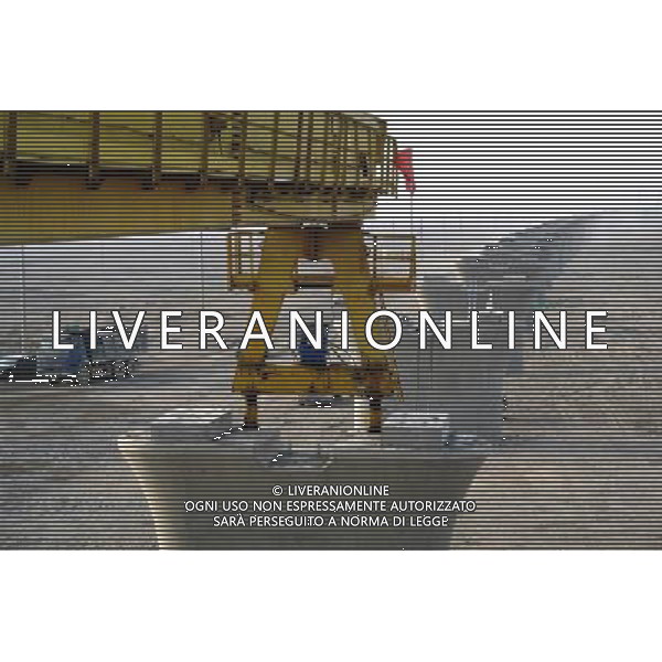 (101201) -- TURPAN, Dec. 1, 2010 () -- Photo taken on Nov. 30, 2010 shows bridge pillars of the Lanzhou-Xinjiang Railway crossing the wind field, which is dubbed as \'ghost\' for that windstorms of above 100 km per hour often running through it which once overthrown a train in 2007, in Turpan, northwest China\'s Xinjiang Uygur Autonomous Region. Workers began laying 900-ton box girders on Tuesday onto those pillars with a total length of 7.795 km in the \'ghost\' wind field. The box girder laying operation will be finish by next April. (/Jiang Xiaoming) (zn) AG. ALDO LIVERANI SAS ITALY ONLY