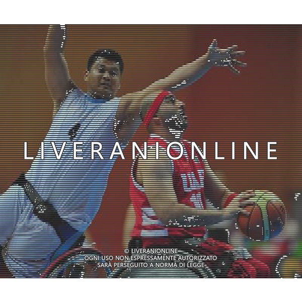 (101215) -- GUANGZHOU, Dec. 15, 2010 () -- Mohamed Alzarouni (R) of the United Arab Emirates competes during the preliminary group A match of men\'s wheelchair basketball competition against Malaysia at the Guangzhou 2010 Asian Para Games in Guangzhou, south China\'s Guangdong Province, Dec. 15, 2010. The United Arab Emirates won 51-46. (/Hao Tongqian) AG. ALDO LIVERANI SAS ITALY ONLY