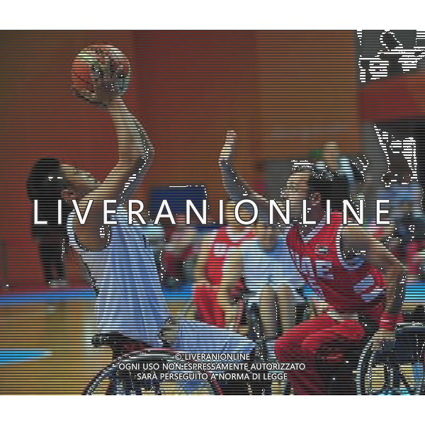 (101215) -- GUANGZHOU, Dec. 15, 2010 () -- Hisam Abras (R) of the United Arab Emirates competes during the preliminary group A match of men\'s wheelchair basketball competition against Malaysia at the Guangzhou 2010 Asian Para Games in Guangzhou, south China\'s Guangdong Province, Dec. 15, 2010. The United Arab Emirates won 51-46. (/Hao Tongqian) AG. ALDO LIVERANI SAS ITALY ONLY