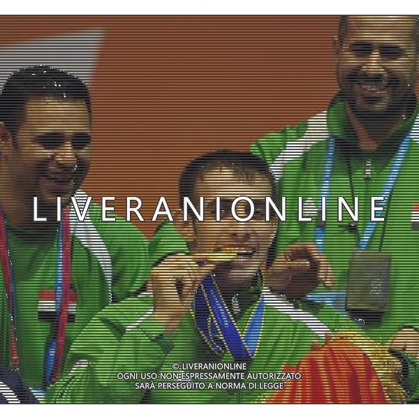 (101215) -- GUANGZHOU, Dec. 15, 2010 () -- Iraq\'s Amar Ali (C) reacts during the awarding ceremony of the men\'s individual epee category B final of wheelchair fencing competition against Chinese Hong Kong\'s Chung TC at the Guangzhou 2010 Asian Para Games in Guangzhou, south China\'s Guangdong Province, Dec. 15, 2010. Amar Ali won 15-13 to claim the champion. (/Liang Xu) AG. ALDO LIVERANI SAS ITALY ONLY