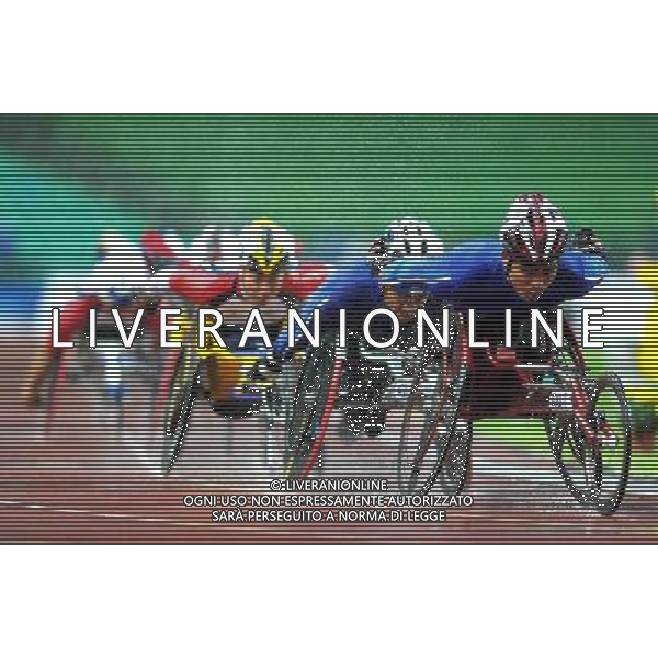 (101215) -- GUANGZHOU, Dec. 15, 2010 () -- Thailand\'s Prawat Wahoram (1st R) competes during the men\'s 5000m T54 final of athletics competition at the Guangzhou 2010 Asian Para Games in Guangzhou, south China\'s Guangdong Province, Dec. 15, 2010. Prawat Wahoram won the gold with 12 minutes and 6.29 seconds. (/Ren Junchuan) AG. ALDO LIVERANI SAS ITALY ONLY