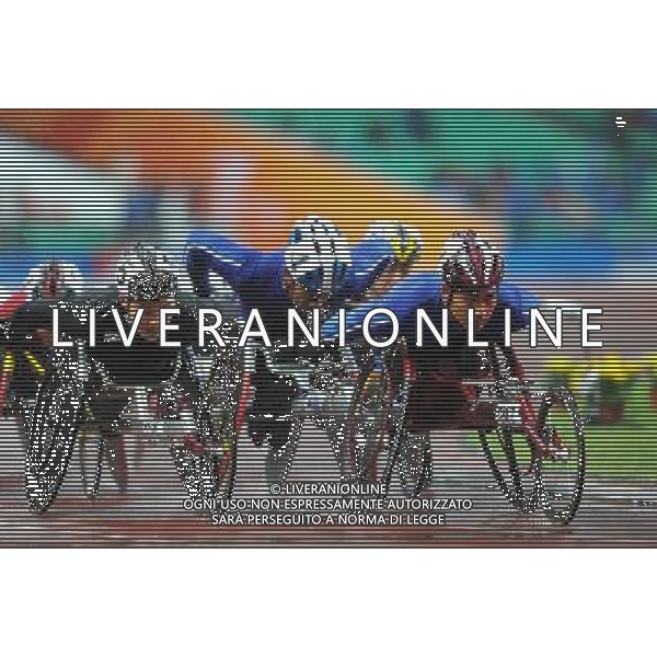 (101215) -- GUANGZHOU, Dec. 15, 2010 () -- Thailand\'s Prawat Wahoram (front R) competes during the men\'s 5000m T54 final of athletics competition at the Guangzhou 2010 Asian Para Games in Guangzhou, south China\'s Guangdong Province, Dec. 15, 2010. Prawat Wahoram won the gold with 12 minutes and 6.29 seconds. (/Ren Junchuan) AG. ALDO LIVERANI SAS ITALY ONLY