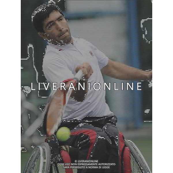 (101215) -- GUANGZHOU, Dec. 15, 2010 () -- Iran\'s Mohammad Yaghoubi returns to India\'s Balachandar Subramanian during the consolation quarterfinal of the men\'s singles open of wheelchair tennis competition at the Guangzhou 2010 Asian Para Games in Guangzhou, south China\'s Guangdong Province, Dec. 15, 2010. Mohammad Yaghoubi won 2-0. (/Yue Yuewei) AG. ALDO LIVERANI SAS ITALY ONLY