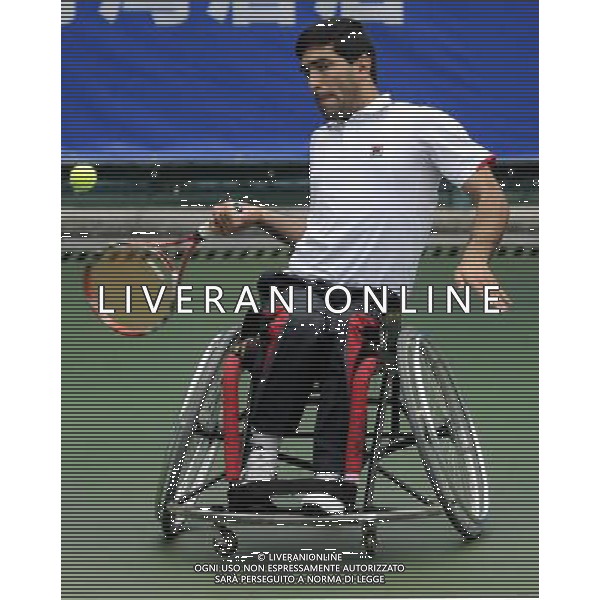 (101215) -- GUANGZHOU, Dec. 15, 2010 () -- Iran\'s Mohammad Yaghoubi returns to India\'s Balachandar Subramanian during the consolation quarterfinal of the men\'s singles open of wheelchair tennis competition at the Guangzhou 2010 Asian Para Games in Guangzhou, south China\'s Guangdong Province, Dec. 15, 2010. Mohammad Yaghoubi won 2-0. (/Yue Yuewei) AG. ALDO LIVERANI SAS ITALY ONLY