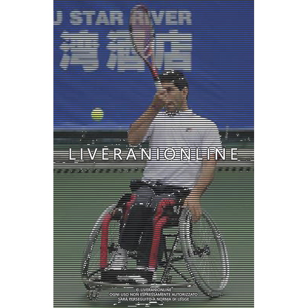 (101215) -- GUANGZHOU, Dec. 15, 2010 () -- Iran\'s Mohammad Yaghoubi returns to India\'s Balachandar Subramanian during the consolation quarterfinal of the men\'s singles open of wheelchair tennis competition at the Guangzhou 2010 Asian Para Games in Guangzhou, south China\'s Guangdong Province, Dec. 15, 2010. Mohammad Yaghoubi won 2-0. (/Yue Yuewei) AG. ALDO LIVERANI SAS ITALY ONLY