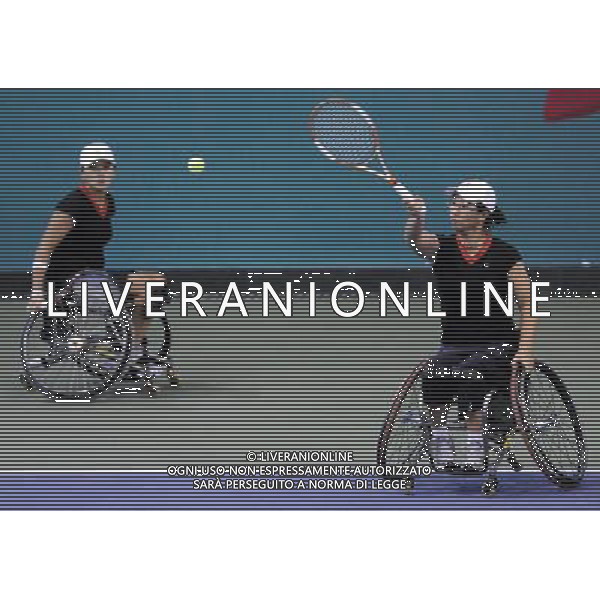 (101215) -- GUANGZHOU, Dec. 15, 2010 () -- Chinese Taipei\'s Lu Chia Yi (R) and Wu Yi Shan compete during the round robin of women\'s doubles of wheelchair tennis competition against Japan\'s Kanako Domori and Yuko Okabe at the Guangzhou 2010 Asian Para Games in Guangzhou, south China\'s Guangdong Province, Dec. 15, 2010. Lu Chia Yi and Wu Yi Shan lost 0-2. (/Yue Yuewei) AG. ALDO LIVERANI SAS ITALY ONLY