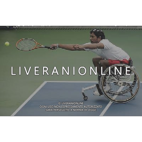 (101215) -- GUANGZHOU, Dec. 15, 2010 () -- India\'s Balachandar Subramanian returns to Iran\'s Mohammad Yaghoubi during the consolation quarterfinal of the men\'s singles open of wheelchair tennis competition at the Guangzhou 2010 Asian Para Games in Guangzhou, south China\'s Guangdong Province, Dec. 15, 2010. Balachandar Subramanian lost 0-2. (/Yue Yuewei) AG. ALDO LIVERANI SAS ITALY ONLY