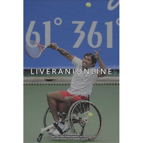 (101215) -- GUANGZHOU, Dec. 15, 2010 () -- India\'s Balachandar Subramanian returns to Iran\'s Mohammad Yaghoubi during the consolation quarterfinal of the men\'s singles open of wheelchair tennis competition at the Guangzhou 2010 Asian Para Games in Guangzhou, south China\'s Guangdong Province, Dec. 15, 2010. Balachandar Subramanian lost 0-2. (/Yue Yuewei) AG. ALDO LIVERANI SAS ITALY ONLY