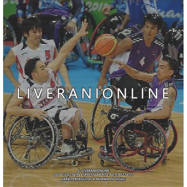 (101215) -- GUANGZHOU, Dec. 15, 2010 () -- Japan\'s Kazuyuki Tokairin (L) vies with Thailand\'s Niwat Kongta during the preliminary group A match of the men\'s wheelchair basketball competition at the Guangzhou 2010 Asian Para Games in Guangzhou, south China\'s Guangdong Province, Dec. 15, 2010. Japan won 64-45. (/Fan Changguo) AG. ALDO LIVERANI SAS ITALY ONLY