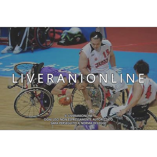 (101215) -- GUANGZHOU, Dec. 15, 2010 () -- Thailand\'s Aekkasit Jumjarean (L) competes during the preliminary group A match of the men\'s wheelchair basketball competition against Japan at the Guangzhou 2010 Asian Para Games in Guangzhou, south China\'s Guangdong Province, Dec. 15, 2010. Japan won 64-45. (/Fan Changguo) AG. ALDO LIVERANI SAS ITALY ONLY