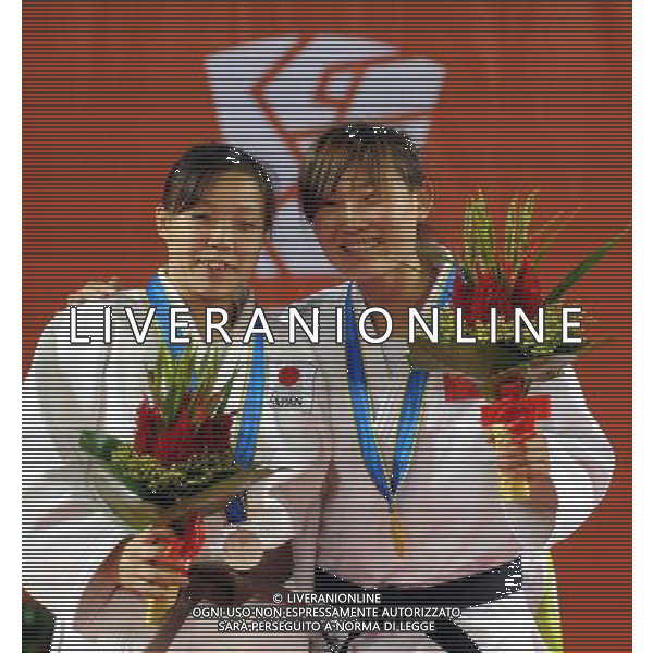 (101215) -- GUANGZHOU, Dec. 15, 2010 () -- China\'s Wang Lijing (R) and Japan\'s Ayumi Tanaka react during the awarding ceremony of the women\'s 57kg judo competition at the Guangzhou 2010 Asian Para Games in Guangzhou, south China\'s Guangdong Province, Dec. 15, 2010. Wang Lijing won the gold and Ayumi Tanaka won the silver of the event.(/Han Chuanhao) AG. ALDO LIVERANI SAS ITALY ONLY