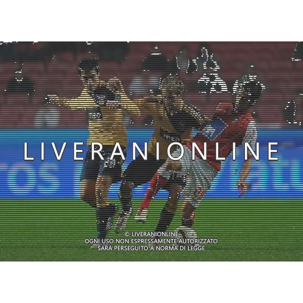 20101212: LISBON, PORTUGAL - SL Benfica vs SC Braga: Portuguese Cup 2010/2011. In picture: Nico Gaitan and Fabio Coentrao (Benfica); Silvio (Braga). PHOTO: Alvaro Isidoro/CITYFILES/NEWSPIX.PL AG ALDO LIVERANI ONLY ITALY 