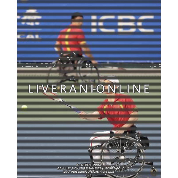 (101216) -- GUANGZHOU, Dec. 16, 2010 () -- China\'s Feng Xiaomin and Wei Zujun (R) compete with South Korea\'s Lee Ha Gel and Oh Sang Ho during the semifinal of the men\'s wheelchair tennis doubles at the 2010 Asian Para Games in Guangzhou, capital city of south China\'s Guangdong Province, Dec. 16, 2010. The Chinese pair lost the match 0-2 . (/Yue Yuewei) (zc) AG. ALDO LIVERANI SAS ITALY ONLY