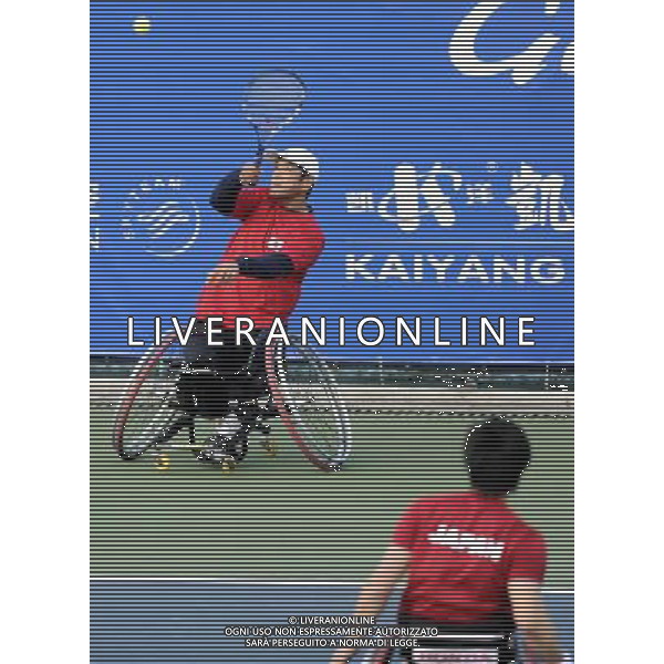 (101216) -- GUANGZHOU, Dec. 16, 2010 () -- Japan\'s Kunieda Shingo and Saida Satoshi (Rear) compete with Thailand\'s Suthi Khlongrua and Sumrerng Kruamai during the semifinal of the men\'s wheelchair tennis doubles at the 2010 Asian Para Games in Guangzhou, capital city of south China\'s Guangdong Province, Dec. 16, 2010. The Japanese pair won 2-0 and advanced into the final. (/Yue Yuewei) (zc) AG. ALDO LIVERANI SAS ITALY ONLY