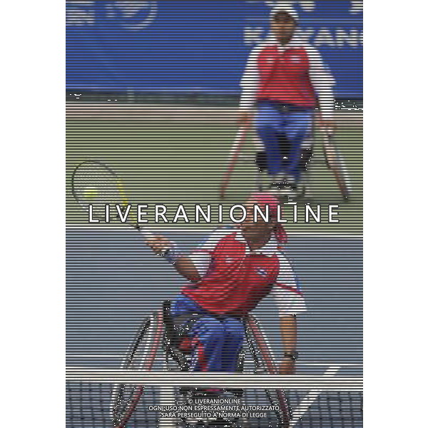 (101216) -- GUANGZHOU, Dec. 16, 2010 () -- Thailand\'s Suthi Khlongrua and Sumrerng Kruamai (front) compete with Japan\'s Kunieda Shingo and Saida Satoshi during the semifinal of the men\'s wheelchair tennis doubles at the 2010 Asian Para Games in Guangzhou, capital city of south China\'s Guangdong Province, Dec. 16, 2010. The Thai pair lost the match 0-2. (/Yue Yuewei) (zc) AG. ALDO LIVERANI SAS ITALY ONLY