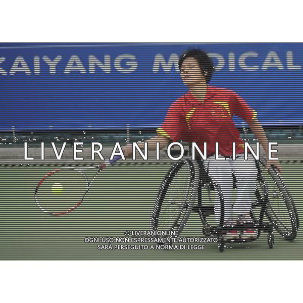 (101216) -- GUANGZHOU, Dec. 16, 2010 () -- China\'s Huang Jinlian hits a shot to Thailand\'s Sakhorn Khanthasit during the semifinal of the women\'s wheelchair tennis singles at the 2010 Asian Para Games in Guangzhou, capital city of south China\'s Guangdong Province, Dec. 16, 2010. Huang Jinlian lost the match 0-2. (/Yue Yuewei) (zc) AG. ALDO LIVERANI SAS ITALY ONLY