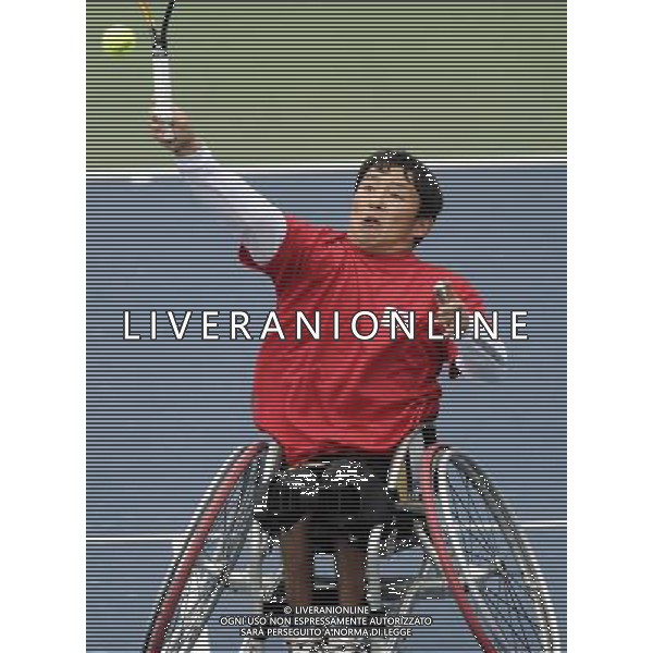 (101216) -- GUANGZHOU, Dec. 16, 2010 () -- Japan\'s Fujimoto Yoshinobu hits a shot to Thailand\'s Suthi Khlongrua during the quarterfinal of the men\'s wheelchair tennis singles at the 2010 Asian Para Games in Guangzhou, capital city of south China\'s Guangdong Province, Dec. 16, 2010. Fujimoto Yoshinobu won 2-0 and advanced into the semifinal. (/Yue Yuewei) (zc) AG. ALDO LIVERANI SAS ITALY ONLY