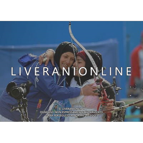 (101216) -- GUANGZHOU, Dec. 16, 2010 () -- Iran\'s Razieh Shir Mohammadi (R) hugs her coach after winning the women\'s archery individual recurve standing final at the 2010 Asian Para Games in Guangzhou, capital city of south China\'s Guangdong Province, Dec. 16, 2010. Razieh Shir Mohammadi beat South Korea\'s Kim Ran Sook in the final 6-2 and took the gold medal of the event. (/Ren Junchuan) (zc) AG. ALDO LIVERANI SAS ITALY ONLY