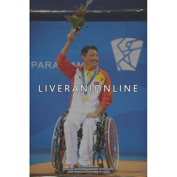 (101216) -- GUANGZHOU, Dec. 16, 2010 () -- China\'s Bai Gang celebrates on the awarding podium after winning the men\'s table tennis singles TT5 final at the 2010 Asian Para Games in Guangzhou, capital city of south China\'s Guangdong Province, Dec. 16, 2010. Bai Gang beat Iran\'s Javad Fouladitarghi in the final 3-1 and took the gold medal of the event. (/Xu Yu) (zc) AG. ALDO LIVERANI SAS ITALY ONLY