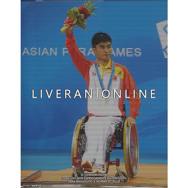 (101216) -- GUANGZHOU, Dec. 16, 2010 () -- China\'s Cao Ningning celebrates on the awarding podium after winning the men\'s table tennis singles TT4 final at the 2010 Asian Para Games in Guangzhou, capital city of south China\'s Guangdong Province, Dec. 16, 2010. Cao beat South Korea\'s Kim Jung Gil in the final by 3-0 and took the gold medal of the event. (/Xu Yu) (zc) AG. ALDO LIVERANI SAS ITALY ONLY