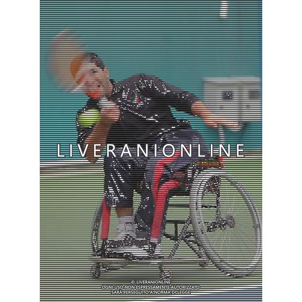 (101216) -- GUANGZHOU, Dec. 16, 2010 () -- Iran\'s Mohammad Yaghoubi hits a shot to Malaysia\'s Kee Kim Hong during the men\'s wheelchair tennis singles consolation semifinal at the 2010 Asian Para Games in Guangzhou, capital city of south China\'s Guangdong Province, Dec. 16, 2010. Yaghoubi advanced into the final after a 2-0 win. (/Yue Yuwei) (zc) AG. ALDO LIVERANI SAS ITALY ONLY