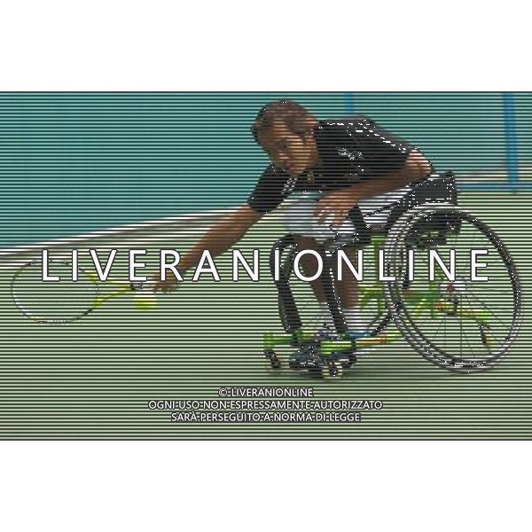 (101216) -- GUANGZHOU, Dec. 16, 2010 () -- Malaysia\'s Kee Kim Hong hits a shot to Iran\'s Mohammad Yaghoubi during the men\'s wheelchair tennis singles consolation semifinal at the 2010 Asian Para Games in Guangzhou, capital city of south China\'s Guangdong Province, Dec. 16, 2010. Kee Kim Hong lost the match 0-2. (/Yue Yuwei) (zc) AG. ALDO LIVERANI SAS ITALY ONLY