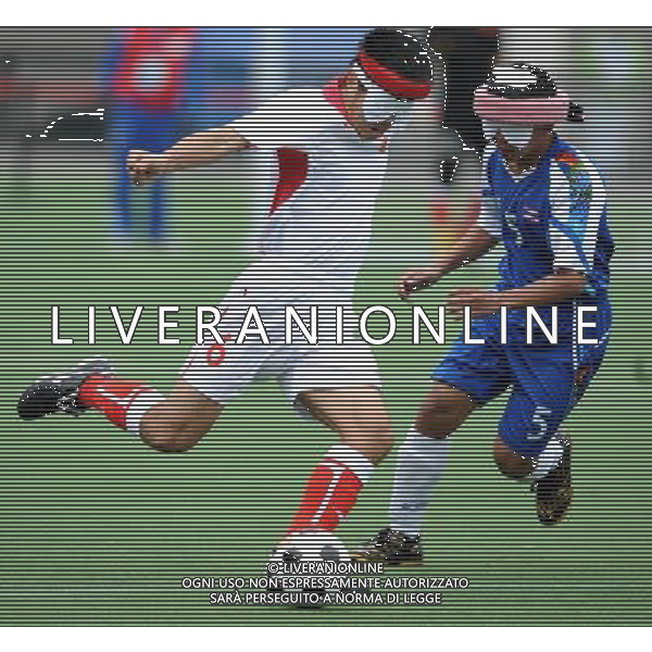 (101216) -- GUANGZHOU, Dec. 16, 2010 () -- China\'s Yu Yutan (L) vies with Chinakorn Pongsapang of Thailand during the men\'s football 5-a-side preliminary match between China and Thailand at the 2010 Asian Para Games in Guangzhou, capital city of south China\'s Guangdong Province, Dec. 16, 2010. China won 5-0. (/Nie Jianjiang) (zc) AG. ALDO LIVERANI SAS ITALY ONLY