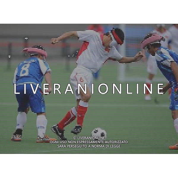 (101216) -- GUANGZHOU, Dec. 16, 2010 () -- Yu Yutan (C) of China controls the ball during the men\'s football 5-a-side preliminary match between China and Thailand at the 2010 Asian Para Games in Guangzhou, capital city of south China\'s Guangdong Province, Dec. 16, 2010. China won 5-0. (/Nie Jianjiang) (zc) AG. ALDO LIVERANI SAS ITALY ONLY