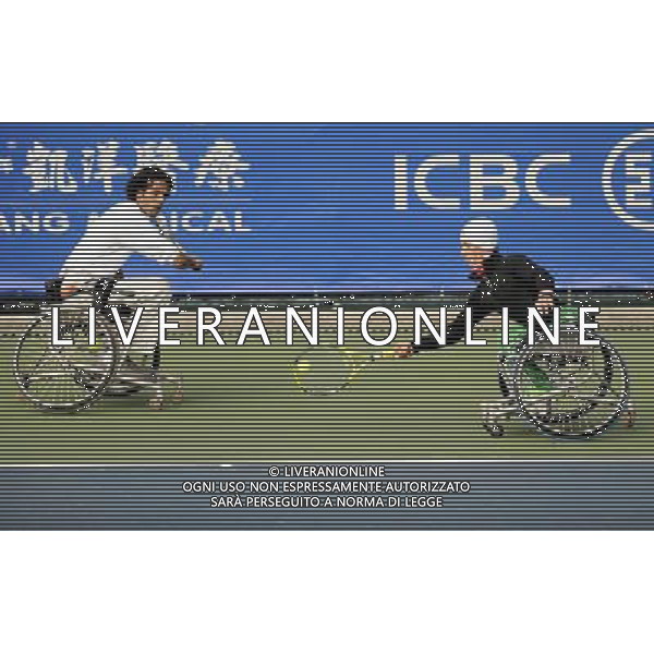 (101216) -- GUANGZHOU, Dec. 16, 2010 () -- Iraqi pair Mohammed Hamdan and Mohammed Thalij (R) compete with South Korean pair Lee Ha Gel and Oh Sang Ho during the quarterfinal of the men\'s wheelchair tennis doubles at the 2010 Asian Para Games in Guangzhou, capital city of south China\'s Guangdong Province, Dec. 16, 2010. The Iraqi pair lost the match 0-2. (/Yue Yuewei) (zc) AG. ALDO LIVERANI SAS ITALY ONLY