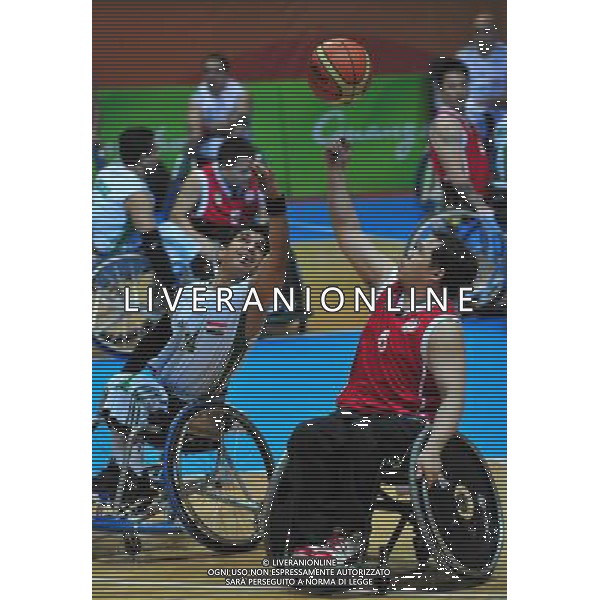 (101213) -- GUANGZHOU, Dec. 13, 2010 () -- Iraq\'s Ayad Al Hameedawi (L) vies for the ball with Lee Chi Hung of Hong Kong of China during the men\'s wheelchair basketball preliminary Group B match at the Guangzhou 2010 Asian Para Games in Guangzhou, south China\'s Guangdong Province, Dec. 13, 2010. (/Hao Tongqian) AG. ALDO LIVERANI SAS ITALY ONLY