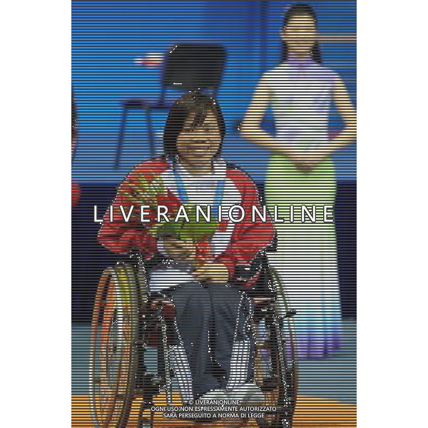 (101213) -- GUANGZHOU, Dec. 13, 2010 () -- Bronze medalist Nguyen Thi Hong of Vietnam smiles during the awarding ceremony for the women\'s powerlifting -40kg event at the Guangzhou 2010 Asian Para Games in Guangzhou, south China\'s Guangdong Province, Dec. 13, 2010. (/Fan Changguo) AG. ALDO LIVERANI SAS ITALY ONLY