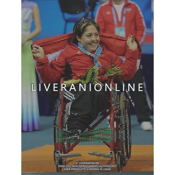(101213) -- GUANGZHOU, Dec. 13, 2010 () -- Silver medalist Noura Baddour of Syria smiles during the awarding ceremony for the women\'s powerlifting -40kg event at the Guangzhou 2010 Asian Para Games in Guangzhou, south China\'s Guangdong Province, Dec. 13, 2010. (/Fan Changguo) AG. ALDO LIVERANI SAS ITALY ONLY