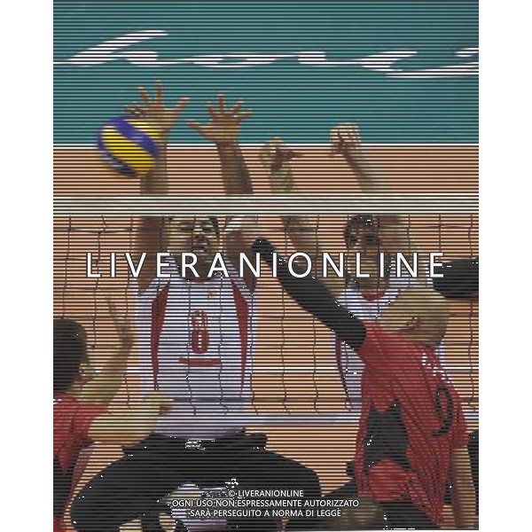 (101213) -- GUANGZHOU, Dec. 13, 2010 () -- Jalil Eimery (2nd L) of Iran competes during the preliminary pool B match of men\'s volleyball sitting against Japan at the Guangzhou 2010 Asian Para Games in Guangzhou, south China\'s Guangdong Province, on Dec. 13, 2010. Iran won 3-0. (/Jiang Hongjing) AG. ALDO LIVERANI SAS ITALY ONLY